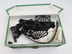 Various vintage carved jet buckles, a dress ornament as a scarab, some loose beads, a half-choker