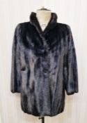 A vintage black saga mink three quarter length with bell sleeves, black satin lining embroidered