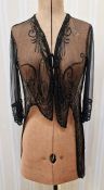 A 1920's/30's silk chiffon jacket, embroidered with faux jet bead decoration, beaded half belt on