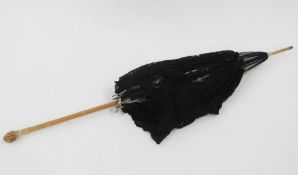 Late 19th/early 20th century parasol with a carved wooden handle as bamboo, black lace with a