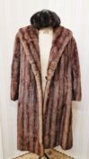 A vintage brown mink coat labelled 