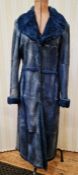 An Escada blue distressed leather coat, lined and trimmed with blue rabbit fur, four clip
