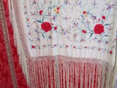 Large Chinese silk embroidered shawl with peonies and other floral detail, with a deep silk fringe