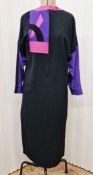 A black wool crepe dress with pink leather, black velvet and black leather detail labelled 