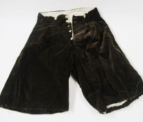 Various mid 20th century page boy outfits with satin breeches, cream flounced shirts, other boys