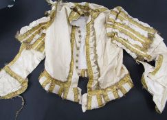 Assorted fancy dress created from vintage clothes, a straw hat, a pair of metal spurs, a Carolean-