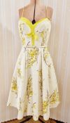 1960's cotton party dress with yellow forsythia printed onto a cream ground, yellow lining to the