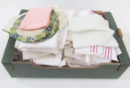 Two pairs of linen sheets, quantity of table linen to include table cloths, hand towels, mats,