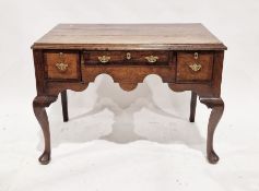 Georgian oak lowboy having one long and two short drawers to the front, each with brass handles