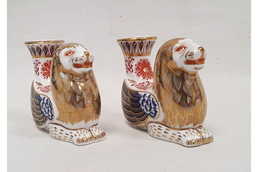Pair of Royal Crown Derby bone china imari pattern mythical beast candlesticks, each modelled as a - Image 1 of 4