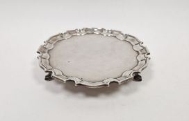 Edwardian silver card tray, raised on three hoof feet, hallmarked London 1906 by C S Harris & Sons