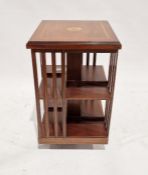20th century mahogany revolving bookcase of square form, with inlaid marquetry decoration to the