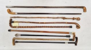 Collection of Victorian and later walking sticks including silver mounted examples, examples with