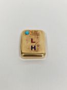 Gold-coloured metal, turquoise and enamel vesta case, rounded rectangular, set with single turquoise