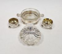 Elizabeth II silver scallopshell shaped butter dish, raised on three bun feet, hallmarked Birmingham