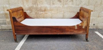 Late 19th/early 20th century Lit Bateau-style single bedstead, the head and footboards with brass