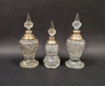Matched pair of silver mounted cut glass perfume bottles, each with pointed stoppers, hallmarks