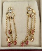 18ct gold, peach and white stone set earrings having white stone above crescent shape with three