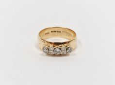 9ct gold and diamond ring having yellow band set with three collet-set diamonds interspersed with