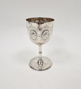Victorian silver goblet, decorated with embossed and engraved foliate motifs, with slender stem on
