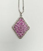9ct white gold and pink stone set pendant of shaped lozenge form, set multiple stones and an 18ct