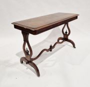 Victorian mahogany occasional table of rectangular form, having single carved flowing stretcher,