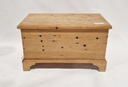 20th century pine coffer of rectangular form, raised on ogee bracket feet, 55cm high x 92cm wide x