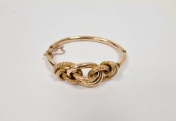 Edwardian gold-coloured metal knot-pattern bangle with engraved decoration, dated 31/08/05, 14g