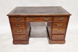 Victorian mahogany twin-pedestal desk with brass handles, having one long drawer flanked by single