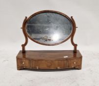 Late 19th/early 20th century mahogany dressing table swing mirror, of oval form, raised over a