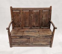 Early oak settle with box base and a panelled back, 113cm high x 125cm wide x 53cm deep