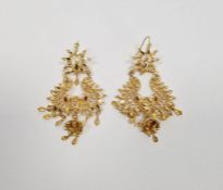 Pair of Indian gold-coloured metal and enamel earrings, foliate and scroll with chandelier-style