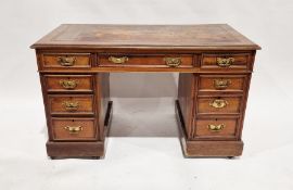Late 19th/early 20th century mahogany twin-pedestal desk with gilt tooled leather top, the top