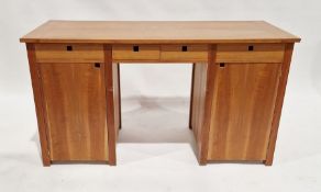 20th century twin-pedestal cherry wood desk having four short drawers with a single door cupboard on