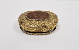 19th century gilt metal mounted agate snuffbox, the oval top C-scroll decorated inset with orange