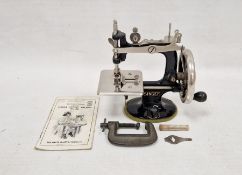 Miniature Singer sewing machine, no.20, with original instructions, clamp, box with needles (very