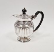 Edwardian silver water jug, with embossed and engraved decoration and wooden handle and knob lid,