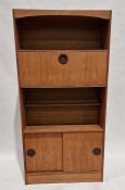 Pair of mid century teak wall units, one with two shelves above cupboard section, the other with