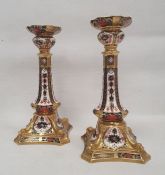 Pair of Royal Crown Derby bone china imari pattern candlesticks, printed iron red marks, pattern