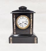 Victorian black slate mantel clock of architectural form, white dial with roman numerals flanked