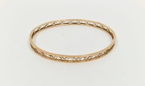 9ct gold slave bangle with shaped oval piercing, 10g approx.  Condition Report Light surface