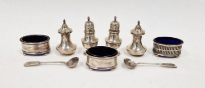 Collection of silver condiments, to include pepper pots, open mustard pots of oval form with blue