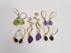 Pair 18K Iliana blue stone drop earrings set with teal blue oval stones, another similar pair set