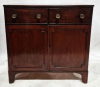 Victorian mahogany linen press/chest of drawers having two short drawers raised over a two-door