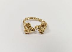 Gold-coloured metal ring in the form of crossover twin ram’s head, 5g approx.