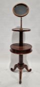 Victorian mahogany shaving stand, the circular vanity mirror over shelf and a lower circular drum-