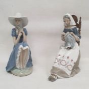 Lladro figure of 'The Embroiderer', modelled seated on a chair embroidering, 27cm high and a Nao