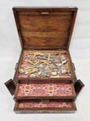 Stained wood canteen comprising a top shelf with two drawers below, containing assorted EPNS