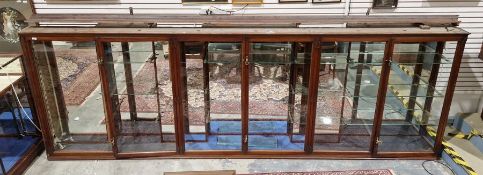 Large wall-mounting Edwardian mahogany glazed display cabinet by Pollard & Co, having three two-door