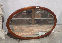 Early 20th century mahogany framed bevelled edge wall mirror of oval form, 70cm x 48cm